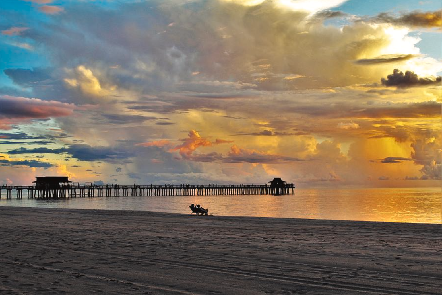 Colorful evening clouds over Naples Pier
